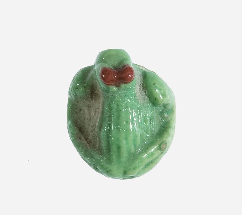 An ancient Egyptian seal amulet of a frog. 